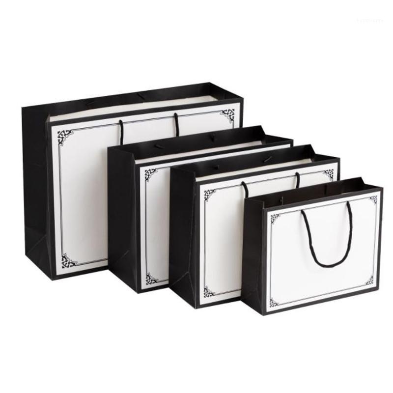 10pcs Black Border Pattern Kraft Paper Bag Shopping Clothing Gift White Paper Bag Wedding Festival Christmas Jewelry Gift1
10pcs Black Border Pattern Kraft Paper Bag Shopping Clothing Gift White Paper Bag Wedding Festival Christmas Jewelry Gift1