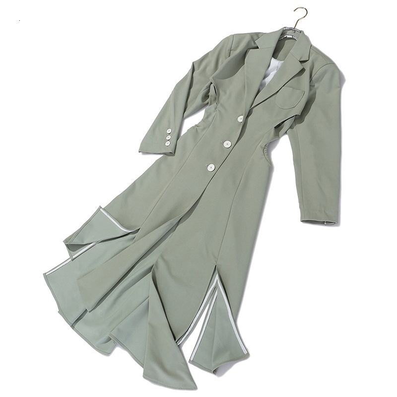 [EAM] Women Asymmetrical Hollow Out Long Trench New Lapel Long Sleeve Loose Fit Windbreaker Fashion Spring Autumn LJ201128