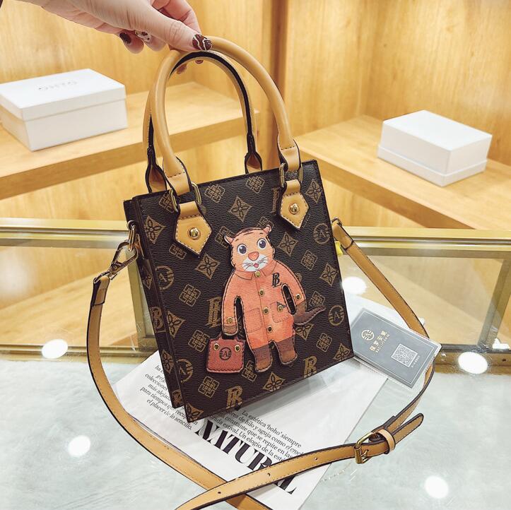 Wholesale factory ladies leathers shoulder bags high quality styling vertical handbag street popular printed leather backpack sweet cute cartoon fashion Tote bag, Brown-6113
Wholesale factory ladies leathers shoulder bags high quality styling vertical handbag street popular printed leather backpack sweet cute cartoon fashion Tote bag, Brown-6113