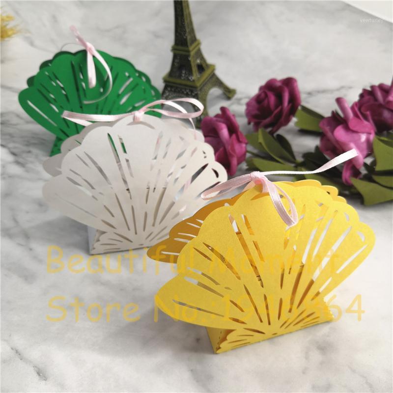 50Pcs Shell Laser Cut Hollow Carriage Favors Box Gifts Candy Boxes With Ribbon Baby Shower Beach Wedding Event Party Supplies1
50Pcs Shell Laser Cut Hollow Carriage Favors Box Gifts Candy Boxes With Ribbon Baby Shower Beach Wedding Event Party Supplies1