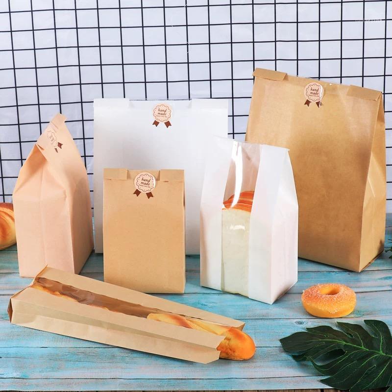 50Pcs/lot White Kraft Paper Bag Toast Bread Packaging Bags With Window Candy Cookie Biscuits Bread Bag Baking Package Gift Bags11 
50Pcs/lot White Kraft Paper Bag Toast Bread Packaging Bags With Window Candy Cookie Biscuits Bread Bag Baking Package Gift Bags11
