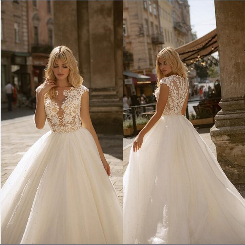 Oksana 2021 Wedding Dresses Capped Sleeve Appliques Lace Beach Bridal Gowns Custom Made Button Back Sweep Train A-Line Wedding Dress, Ivory
Oksana 2021 Wedding Dresses Capped Sleeve Appliques Lace Beach Bridal Gowns Custom Made Button Back Sweep Train A-Line Wedding Dress, Ivory