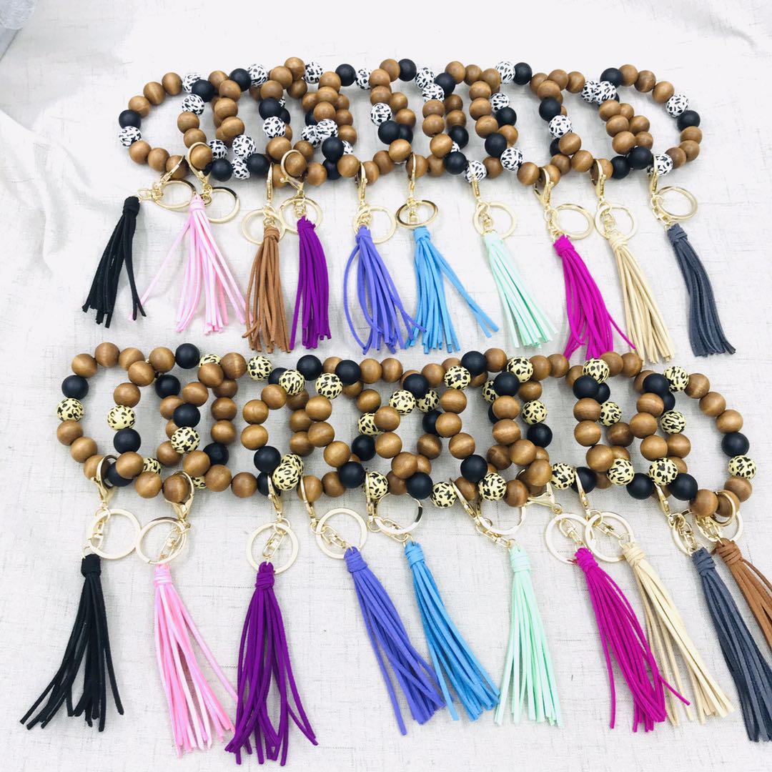 Personalized handmade wholesale stretched Leopard Wood Beaded Keyring trendy popular large wooden beads tassel elastic braceletkeychains
Personalized handmade wholesale stretched Leopard Wood Beaded Keyring trendy popular large wooden beads tassel elastic braceletkeychains