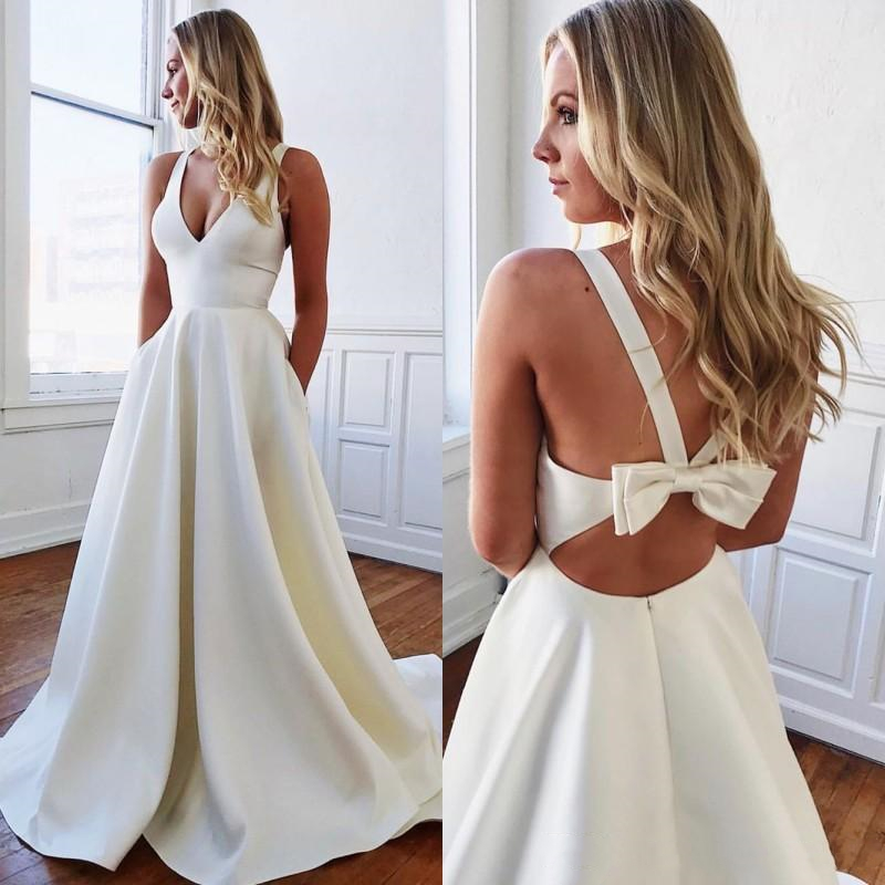 2026 Simple White Satin Wedding Dresses With Pockets Sexy Backless Bow Deep V Neck Straps Boho Beach Wedding Gowns Bridal Dress Vestidos de novia