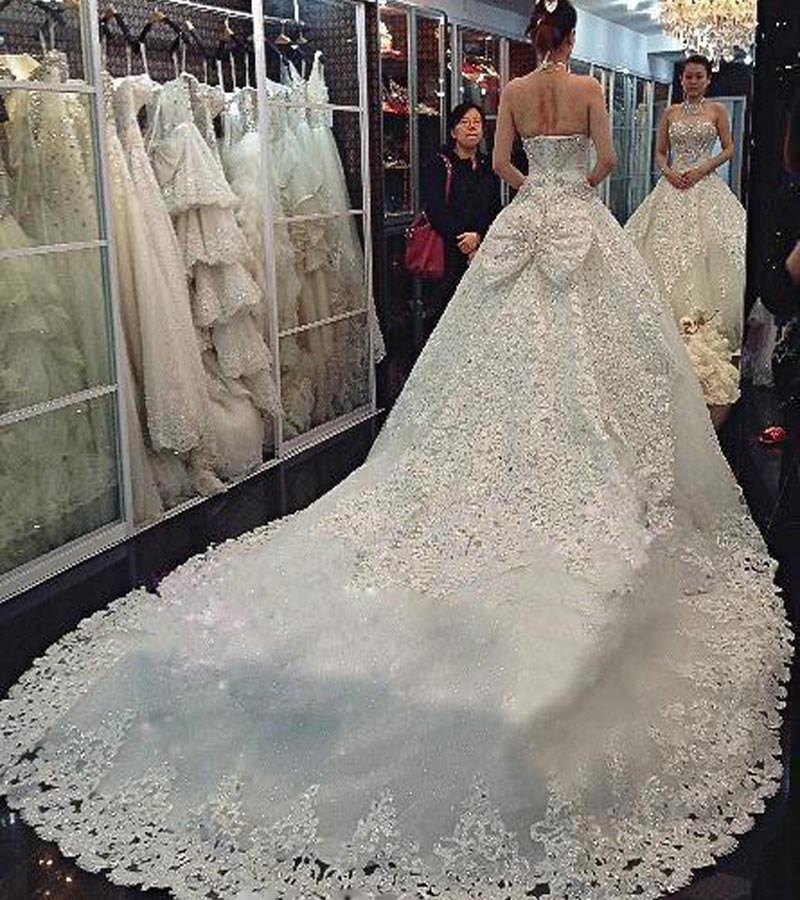 Newest Luxury Wedding Dresses 2020 With Halter Swarovski Crystals Beads Backless A Line Chapel Train Lace Bling Customed Ivory Bridal Gowns