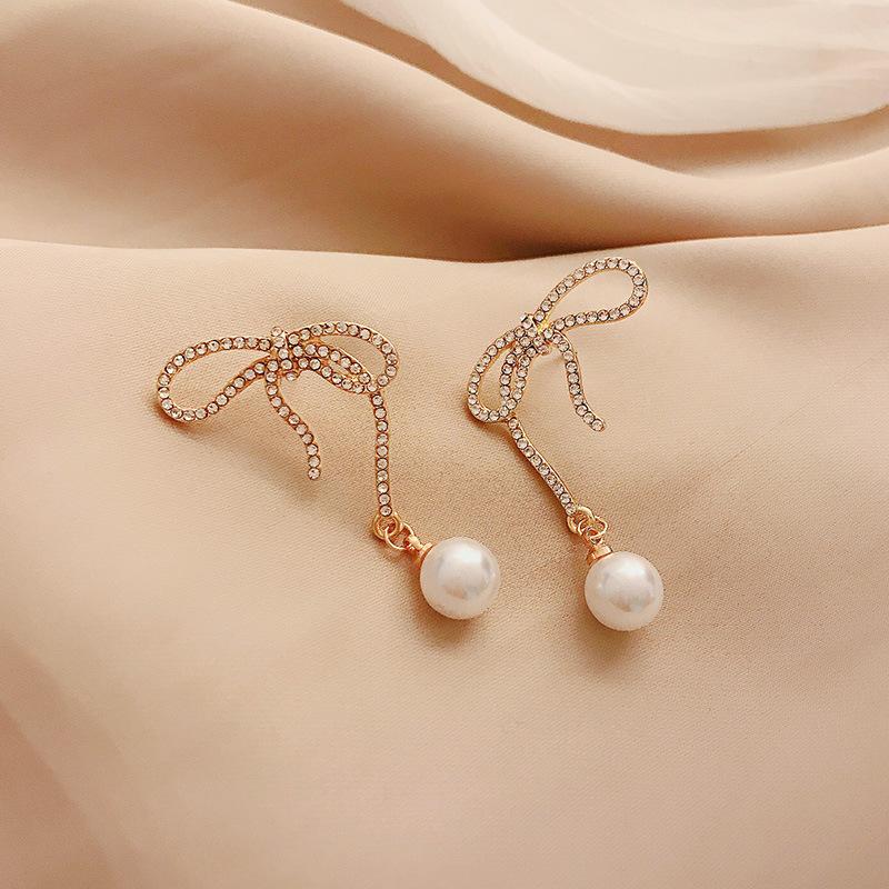 Pearl earrings feminine bow high-end personality Korean earrings 2020 new trendy fashion elegant Fashion Stud
Pearl earrings feminine bow high-end personality Korean earrings 2020 new trendy fashion elegant Fashion Stud