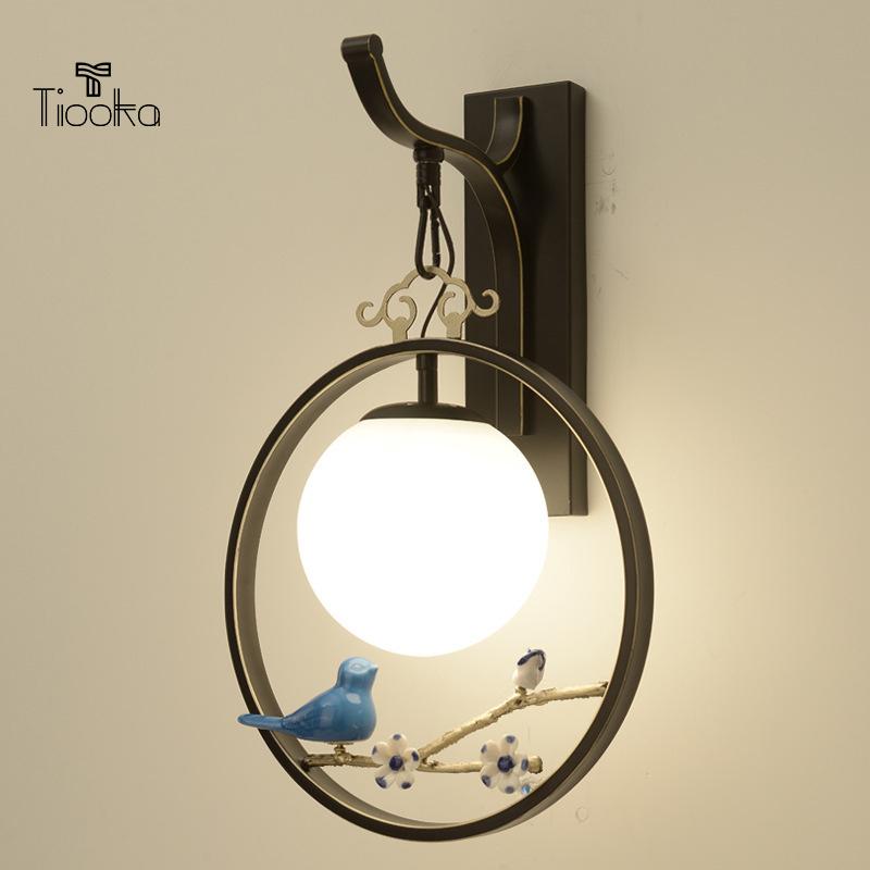 Tiooka Chinese Style Indoor TV Background Wall Sconces Light Black Gold Round Bedside Wall Hanging Lamp with vivid Bird Decor
Tiooka Chinese Style Indoor TV Background Wall Sconces Light Black Gold Round Bedside Wall Hanging Lamp with vivid Bird Decor