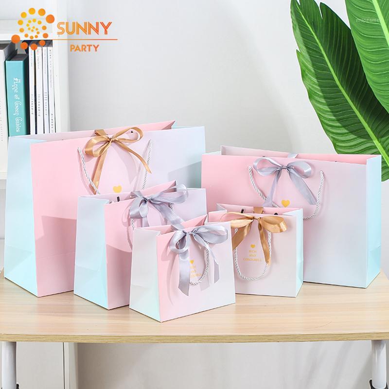 Pink Gradient Paper Package Bags Ribbon Bow-knot Blessing Gift Bags Clothing Store Tote Bag Birthday Souvenir Packaging Supplies1
Pink Gradient Paper Package Bags Ribbon Bow-knot Blessing Gift Bags Clothing Store Tote Bag Birthday Souvenir Packaging Supplies1
