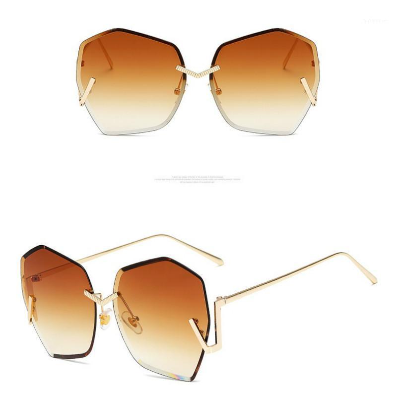 New Rimless Irregular Women Sunglasses Fashion Color Ocean Piece Cut-edge Sun Glasses for Woman Sunshade Mirror Gradient Oculos1
New Rimless Irregular Women Sunglasses Fashion Color Ocean Piece Cut-edge Sun Glasses for Woman Sunshade Mirror Gradient Oculos1