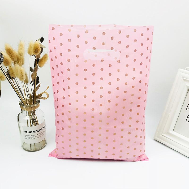 50pcs 25x35cm Pink Gold Dot Plastic Handle Bags Christmas Gift Clothing Packaging Plastic Gift Bag With Handles Shopping Bag1
50pcs 25x35cm Pink Gold Dot Plastic Handle Bags Christmas Gift Clothing Packaging Plastic Gift Bag With Handles Shopping Bag1