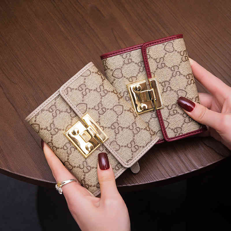 new wallet women's short leather folding multi-function buckle printing card bag versatile purse, Black
new wallet women's short leather folding multi-function buckle printing card bag versatile purse, Black