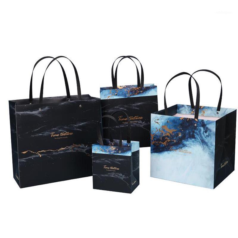 Simple Gilding Gift Bag Blue Black Gilt Marbling Bronzing Rivet New Year Wedding Candy Receiving Hand Carrying Paper Gift Box1
Simple Gilding Gift Bag Blue Black Gilt Marbling Bronzing Rivet New Year Wedding Candy Receiving Hand Carrying Paper Gift Box1