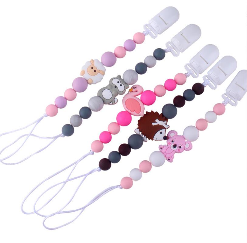 INS baby Safty Silicon Pacifier Holders Clips Candy Colors Beads Ball Design Health Care Teething Pacifier Anti-drop Chain Infant Suitable For 0-3Months
INS baby Safty Silicon Pacifier Holders Clips Candy Colors Beads Ball Design Health Care Teething Pacifier Anti-drop Chain Infant Suitable For 0-3Months
