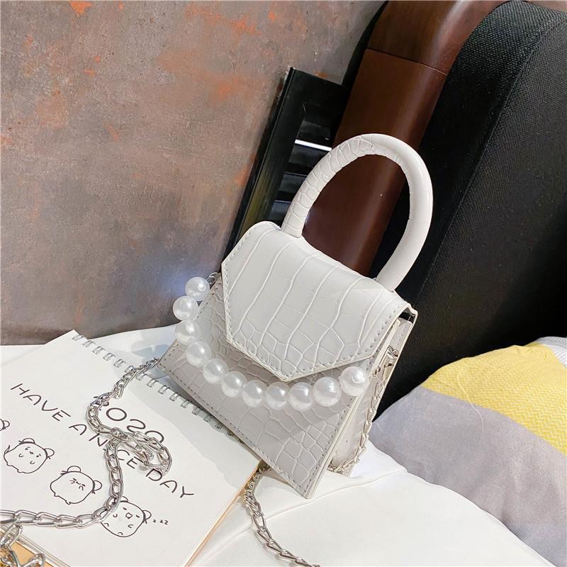 synthetic leather handbag, synthetic leather handbag with pearl handle, postman and hand and shoulder style with stone print, Black
synthetic leather handbag, synthetic leather handbag with pearl handle, postman and hand and shoulder style with stone print, Black
