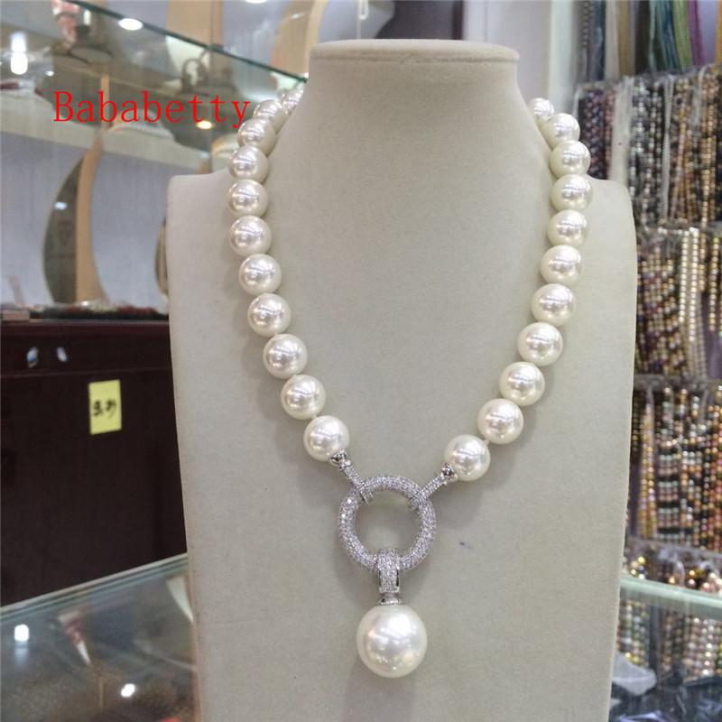 New natural white shell 14 mm necklace with 16 mm pendant 18
New natural white shell 14 mm necklace with 16 mm pendant 18