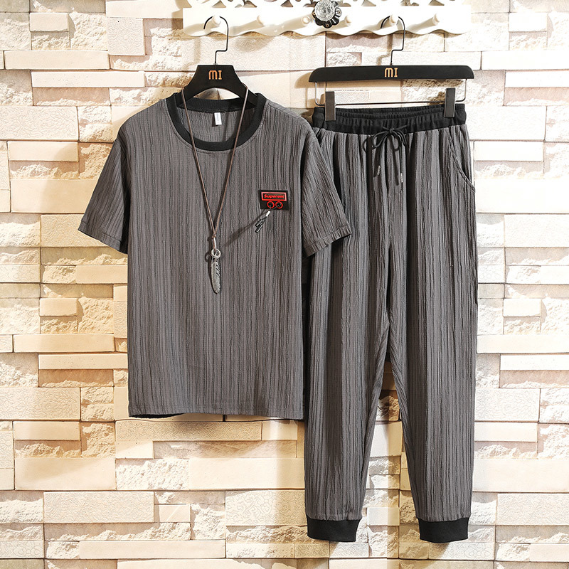 2021 New Summer Set 2pc Sporting Suit Short Sleeve t Shirt+ankle-length Pants Casual Loose Two Piece Tracksuit Sets Clothes Men Cz32, Black 
2021 New Summer Set 2pc Sporting Suit Short Sleeve t Shirt+ankle-length Pants Casual Loose Two Piece Tracksuit Sets Clothes Men Cz32, Black