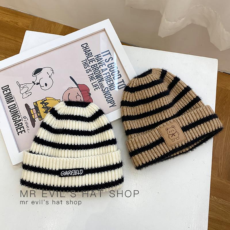 Hat female autumn winter warm black and white stripe ear protection wool hats woman Korean casual style knit hats ins
Hat female autumn winter warm black and white stripe ear protection wool hats woman Korean casual style knit hats ins
