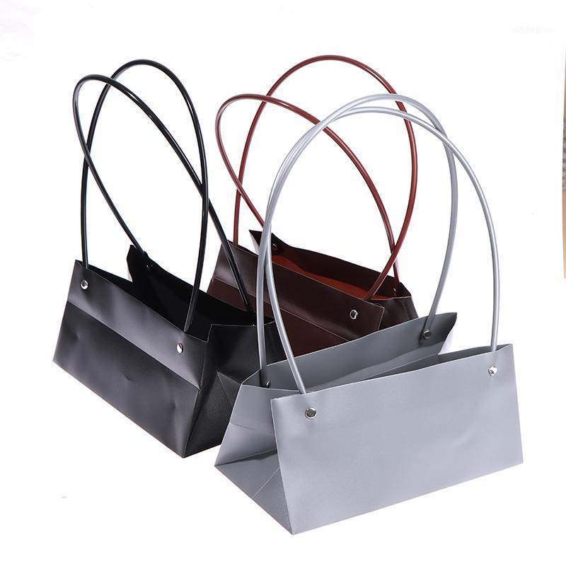 Flowers Carry Bag Kraft Paper Bags Rectangular Flower Box With Handle Waterproof PVC Bouquet Florist Rose Party Decoration Boxes1 
Flowers Carry Bag Kraft Paper Bags Rectangular Flower Box With Handle Waterproof PVC Bouquet Florist Rose Party Decoration Boxes1
