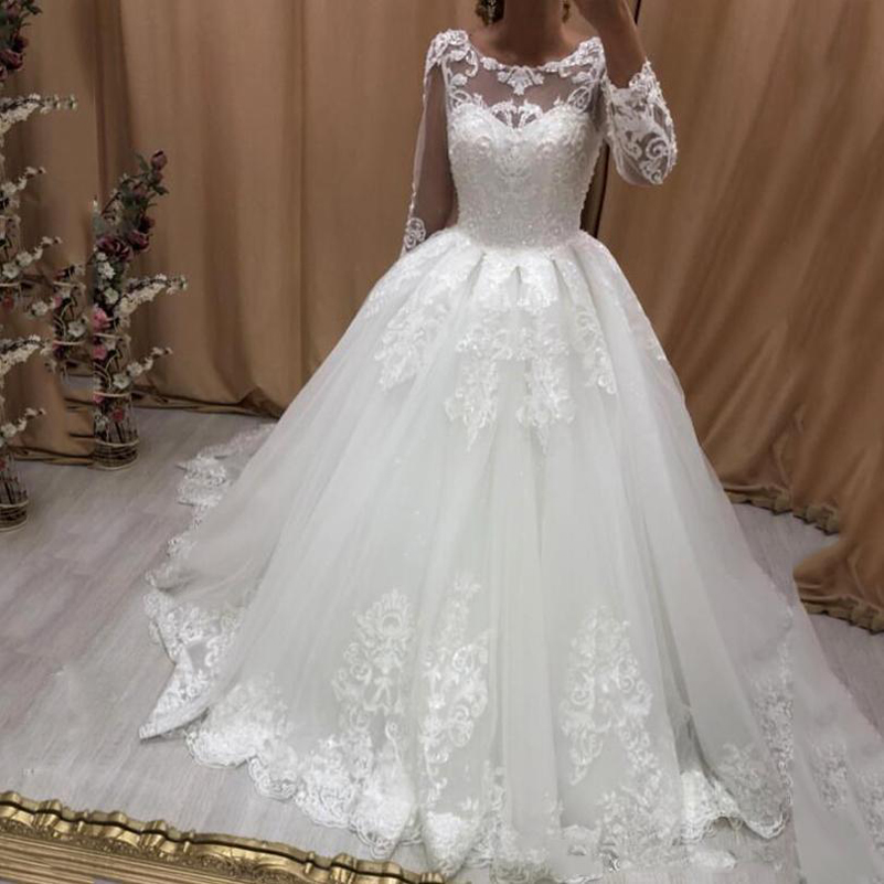 Arabic Long Sleeves Lace Wedding Dresses 2021 with Beads Appliques Jewel Neck Sweep Train Tulle A Line Wedding Bridal Gowns, Champagne
Arabic Long Sleeves Lace Wedding Dresses 2021 with Beads Appliques Jewel Neck Sweep Train Tulle A Line Wedding Bridal Gowns, Champagne