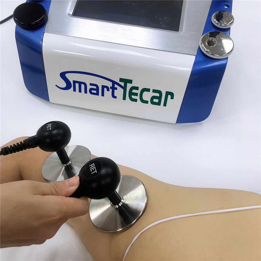 Portable Cet ret rf tecar physical therapy beauty slimming machine on sale Physical Tecar therpay machine for muscles pain relief
Portable Cet ret rf tecar physical therapy beauty slimming machine on sale Physical Tecar therpay machine for muscles pain relief