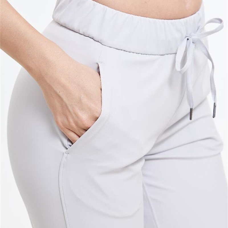 Women Stretch fabrics Loose Fit Sport Active skinny Leggings with two side pockets Ankle-Length Pants 201109