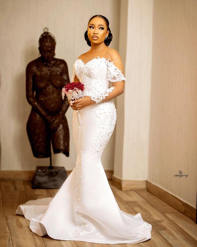 African Sexy Arabic Mermaid Wedding Dresses Jewel Neck Illusion Crystal Beaded Long Sleeves Button Back Satin Court Train Plus Size Bridal Gowns