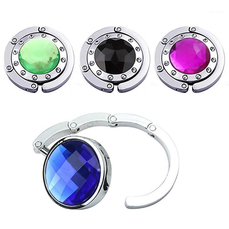 1 Pcs Crystal Alloy Magic Hooks Purse Bag Hanger Foldable Portable Handbag Storage Rack Home Decor Multiple Desk Bag Hanger1
1 Pcs Crystal Alloy Magic Hooks Purse Bag Hanger Foldable Portable Handbag Storage Rack Home Decor Multiple Desk Bag Hanger1