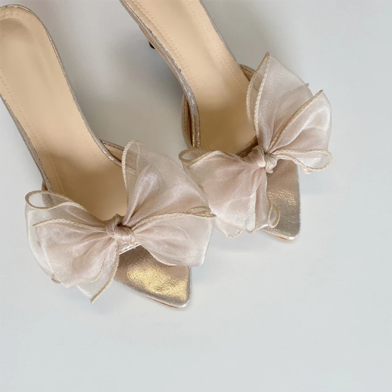 Francine Bow Pointed Mules features an oversized and an upper finished in a soft shimmering champagne tone Dress Heel Slippers 210225