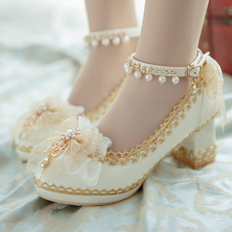 Lolita's Sweet Girl Tea Wedding Shoes Diamond Stylish Bow Bombs Pointed to the Ankle Strap Japanese Sandals Lolita Rnrl, Beige.
Lolita's Sweet Girl Tea Wedding Shoes Diamond Stylish Bow Bombs Pointed to the Ankle Strap Japanese Sandals Lolita Rnrl, Beige.
