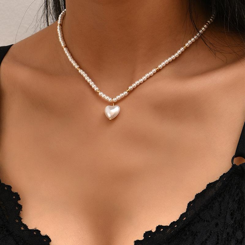 Elegant Small Round Pearl Necklace Cute Heart Pendant Necklace for Women Gold Bead Vintage Bohemian Clavicle Chain Accessories
Elegant Small Round Pearl Necklace Cute Heart Pendant Necklace for Women Gold Bead Vintage Bohemian Clavicle Chain Accessories