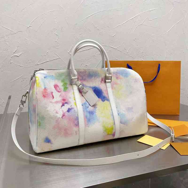 2021ss Fashion Men 45cm Duffle Bag Black Multicolor Leather Travel Bags Women Handle and Strap Luggage Mens Business Briefcase Tote
2021ss Fashion Men 45cm Duffle Bag Black Multicolor Leather Travel Bags Women Handle and Strap Luggage Mens Business Briefcase Tote