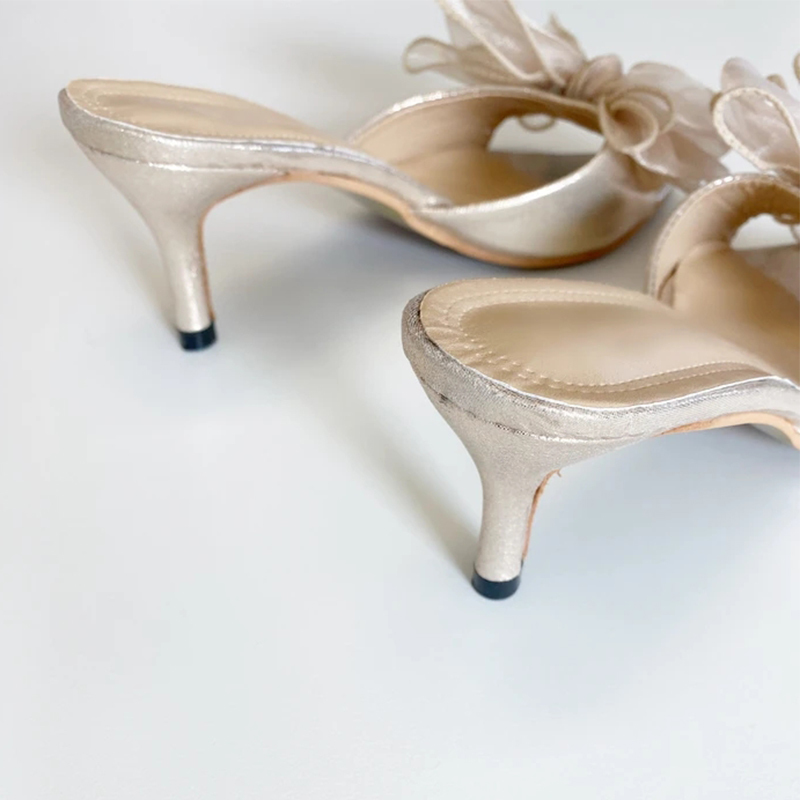 Francine Bow Pointed Mules features an oversized and an upper finished in a soft shimmering champagne tone Dress Heel Slippers 210225