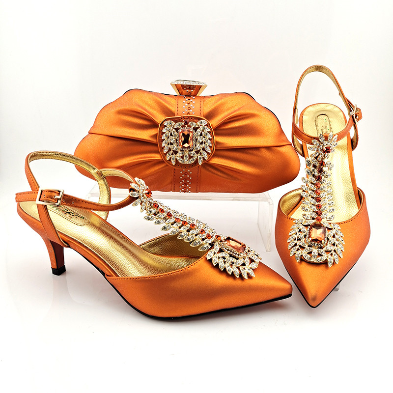 Nice looking orange wemon shoes match purse with rhinestone african pumps and handbag set for dress MM1106,heel 7CM
Nice looking orange wemon shoes match purse with rhinestone african pumps and handbag set for dress MM1106,heel 7CM