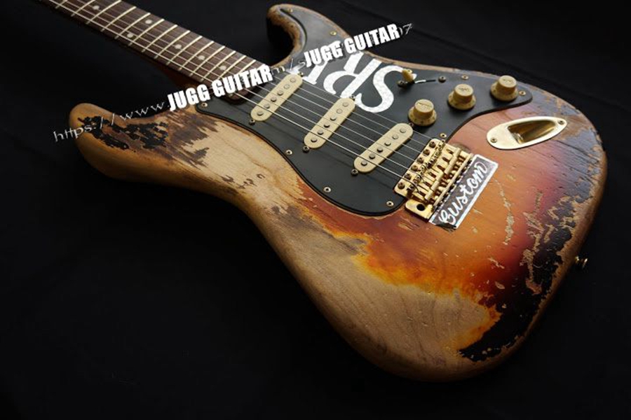 Masterbuilt Relic Stevie Ray Vaughan 3 Tone Sunburst SRV Electric Guitar Tremolo Bridge & Whammy Bar, Alder Body, Vintage Tuners, Gold Hardware, Black Pickguard
Masterbuilt Relic Stevie Ray Vaughan 3 Tone Sunburst SRV Electric Guitar Tremolo Bridge & Whammy Bar, Alder Body, Vintage Tuners, Gold Hardware, Black Pickguard