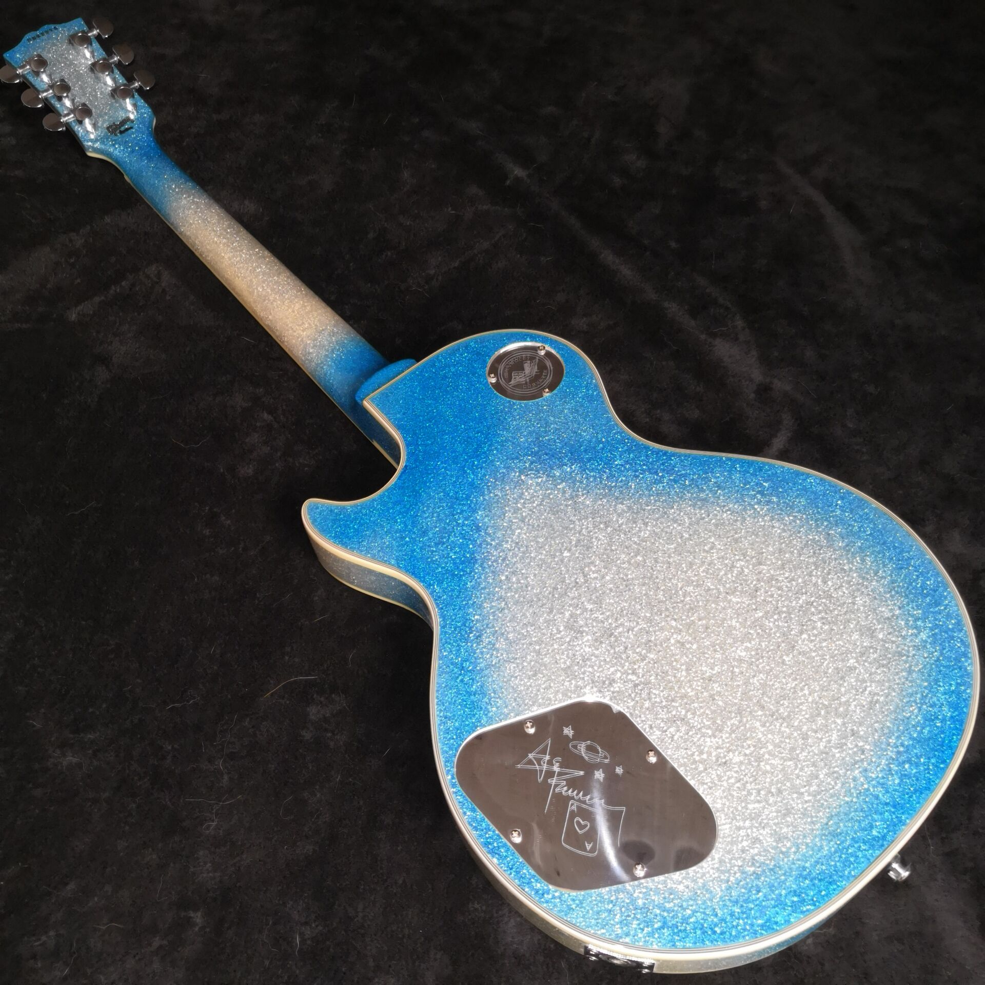 Ace Frehley Budokan Big Sparkle Blue Silver Burst Electric Guitar Ebony Fingerboard, Aluminm Back Covers & Truss Rod Cover, Flash Inlay
Ace Frehley Budokan Big Sparkle Blue Silver Burst Electric Guitar Ebony Fingerboard, Aluminm Back Covers & Truss Rod Cover, Flash Inlay