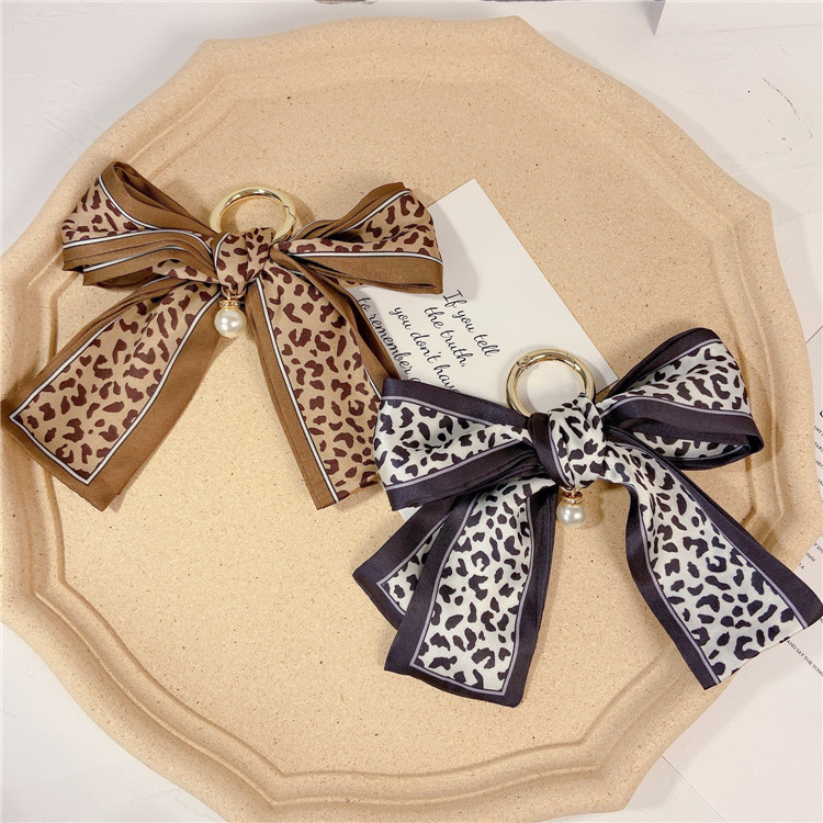 korean silk scarf bow key chain personalized pearl tie bag pendant net red woven ring, Silver
korean silk scarf bow key chain personalized pearl tie bag pendant net red woven ring, Silver