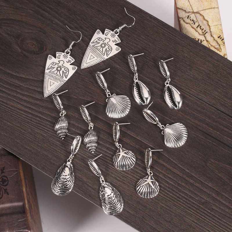 earring holiday seashore shell sier pattern triangle totem bird personality show face small earrings, Golden
earring holiday seashore shell sier pattern triangle totem bird personality show face small earrings, Golden