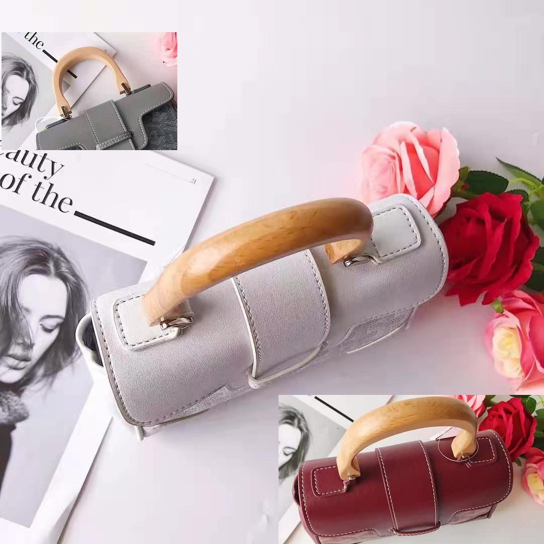 Unique wood handle small tote GOYA bag. Leather good quality Retro saigon totes , Mini women handbag. Drawstring Bucket Bags. 2 different style
Unique wood handle small tote GOYA bag. Leather good quality Retro saigon totes , Mini women handbag. Drawstring Bucket Bags. 2 different style