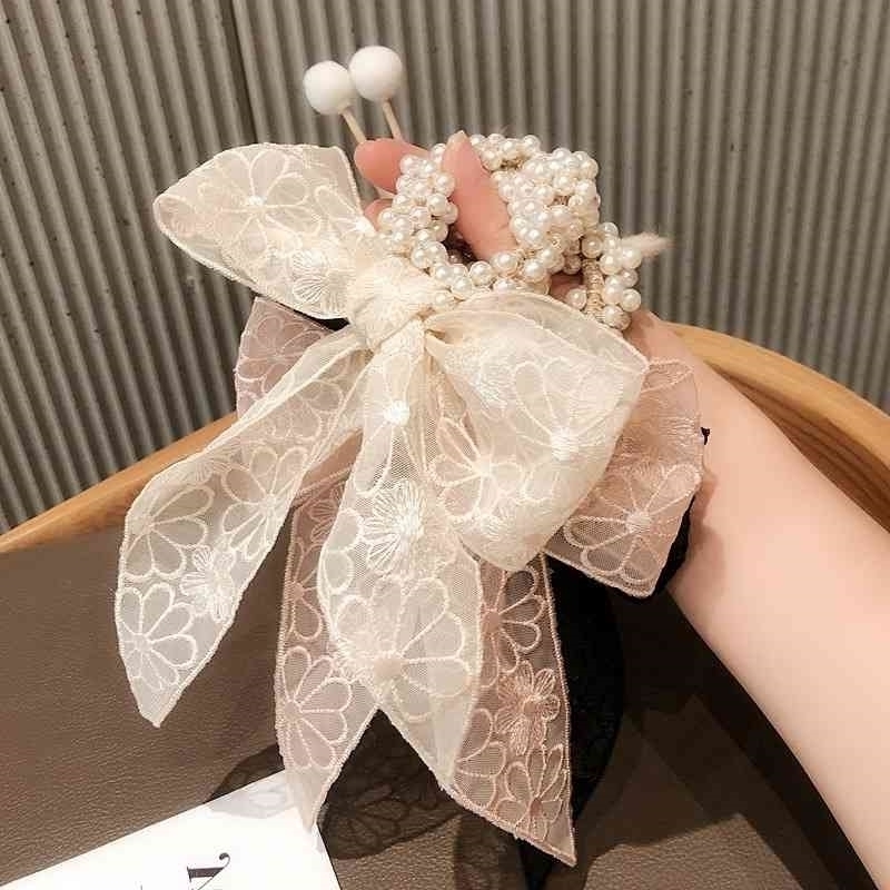 lace Korean Super fairy bow ribbon circle gauze embroidered Scarf Hair rope temperament horsetail tie hair band
lace Korean Super fairy bow ribbon circle gauze embroidered Scarf Hair rope temperament horsetail tie hair band