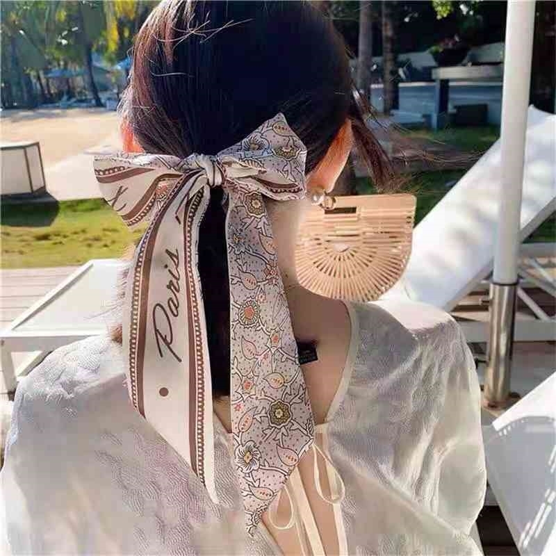 ins Shang xuanyue Korean super fairy long ribbon hair rope Chiffon sweet hairdressing belt Silk Scarf Hair circle girl
ins Shang xuanyue Korean super fairy long ribbon hair rope Chiffon sweet hairdressing belt Silk Scarf Hair circle girl