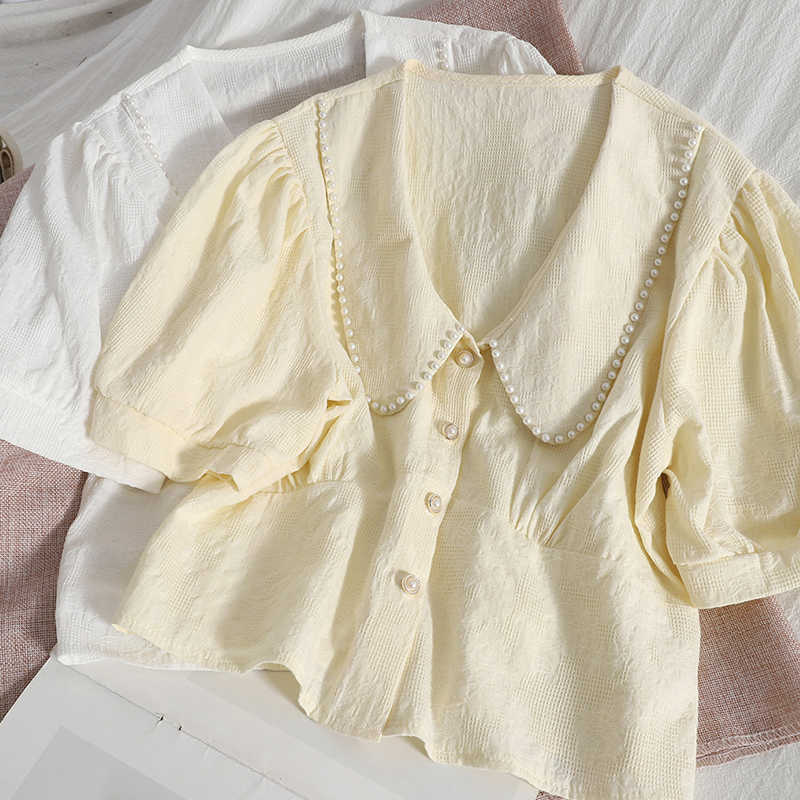 VANOVICH Beaded Lapel Temperament Women Shirt Summer Fashion Puff Sleeve Korean Style Single Breasted Clothing 210615, White
VANOVICH Beaded Lapel Temperament Women Shirt Summer Fashion Puff Sleeve Korean Style Single Breasted Clothing 210615, White