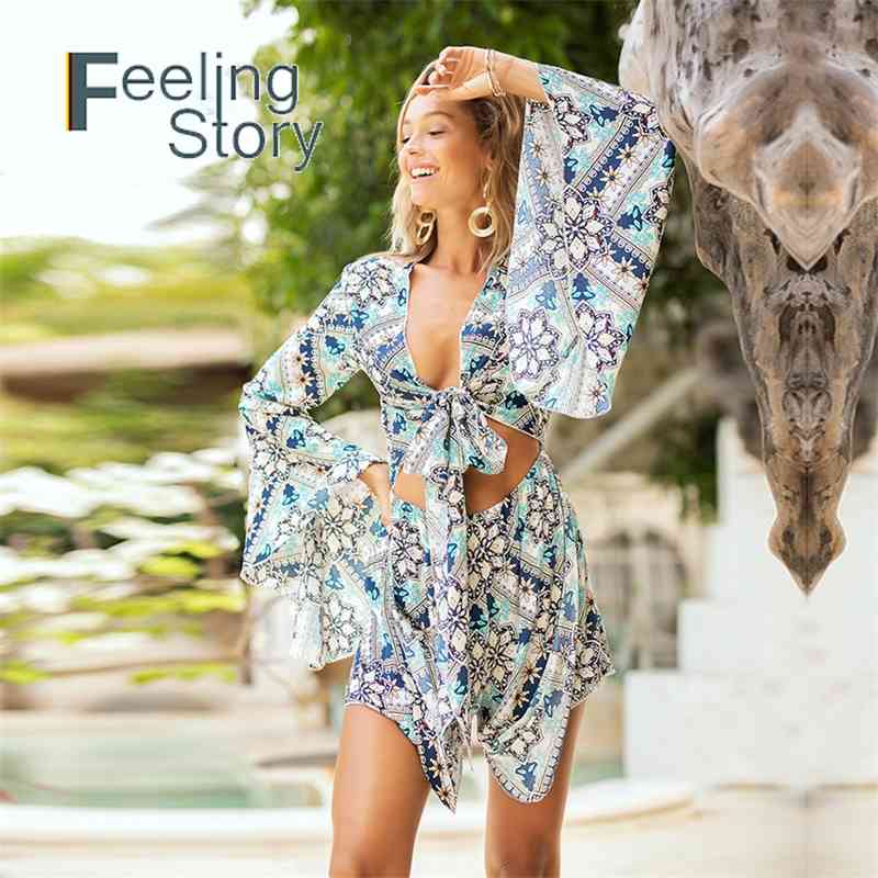 Boho Floral Bat Sleeve Sexy Jumpsuit Women Bow Summer Beach Party Playsuit Short Rompers Womens Overalls 210603
Boho Floral Bat Sleeve Sexy Jumpsuit Women Bow Summer Beach Party Playsuit Short Rompers Womens Overalls 210603