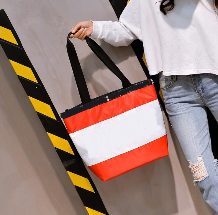 Single storage bags shoulder urban simple diagonal large capacity with letter laser nylon short-distance travel small square bag
Single storage bags shoulder urban simple diagonal large capacity with letter laser nylon short-distance travel small square bag