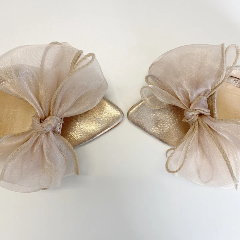 Francine Bow Pointed Mules features an oversized and an upper finished in a soft shimmering champagne tone Dress Heel Slippers 210225