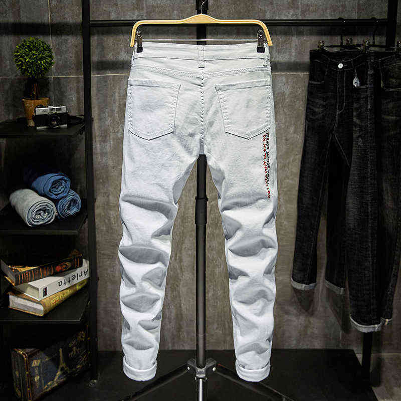 Fashion Trendy Embroidery letters Men College Boys Skinny Runway Zipper Denim Pants Destroyed Ripped Jeans Black White 211111