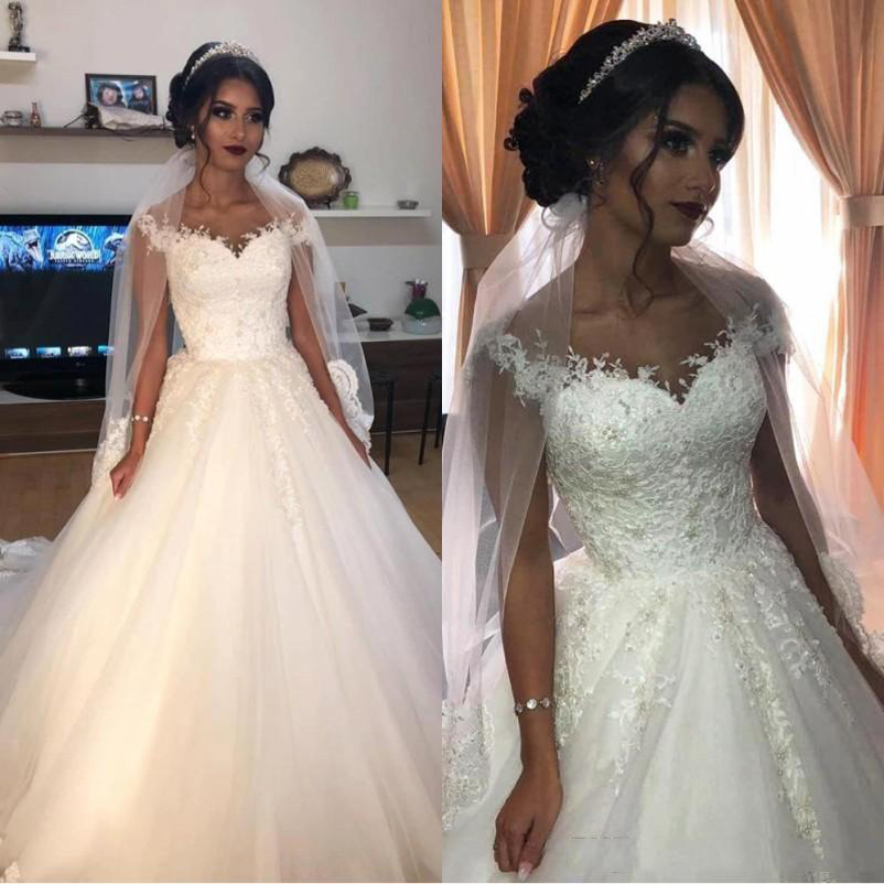 Arabic Off Shoulder Lace Wedding Dresses with Beaded Appliques Cap Sleeves Tulle Sweep Train A Line Plus Size Wedding Bridal Gowns, Black
Arabic Off Shoulder Lace Wedding Dresses with Beaded Appliques Cap Sleeves Tulle Sweep Train A Line Plus Size Wedding Bridal Gowns, Black