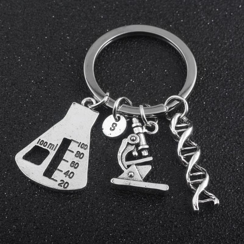 Keychains Chemistry Lab Equipment Jewelry Twist DNA Structure Microscope Triangle Cup Pendant Necklace Keychain Gift For Friends
Keychains Chemistry Lab Equipment Jewelry Twist DNA Structure Microscope Triangle Cup Pendant Necklace Keychain Gift For Friends