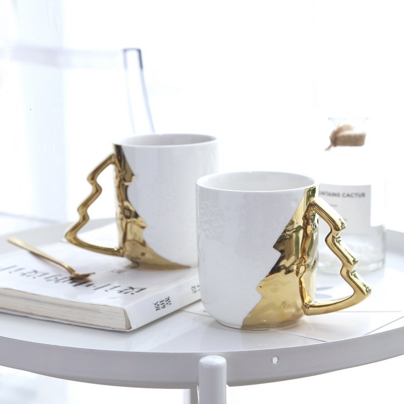 Nordic Light luxury fashion simple creative gold-plated Christmas tree water cup snow texture white ceramic mug
Nordic Light luxury fashion simple creative gold-plated Christmas tree water cup snow texture white ceramic mug