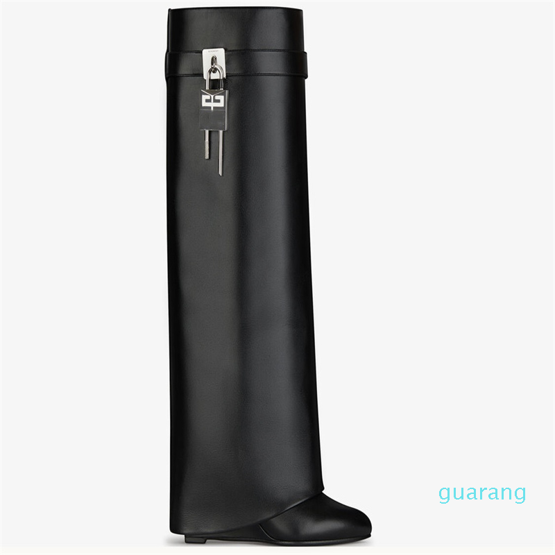 Fashion-Knee boots leather silver and gold finish asymmetrical metal padlock clad wedge almond shaped toe heel height 9cm, Black
Fashion-Knee boots leather silver and gold finish asymmetrical metal padlock clad wedge almond shaped toe heel height 9cm, Black