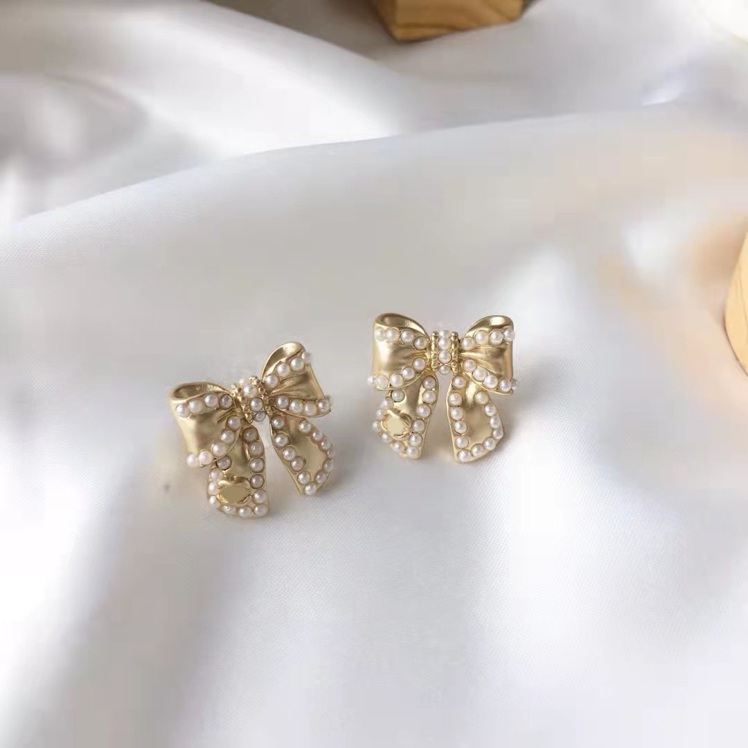 2021 new fashion Knot pearl bow earrings ladies 925 silver needles simple all-match jewelry